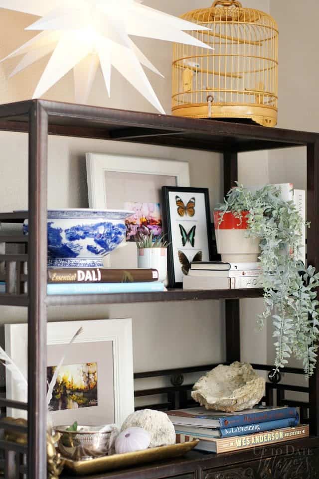 A beautifully styled bookcase with global finds. 