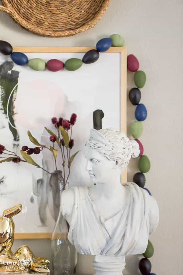 Egg Garland around art and a woman's bust 