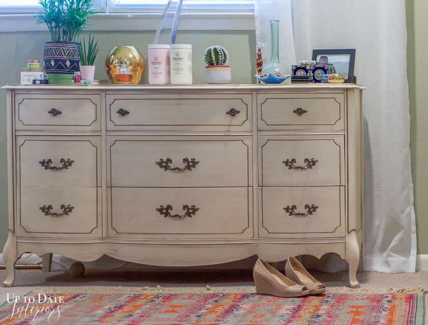 French provincial dresser in bedroom with eclectic rug and shoes.  Before how to paint a dresser without sanding. 