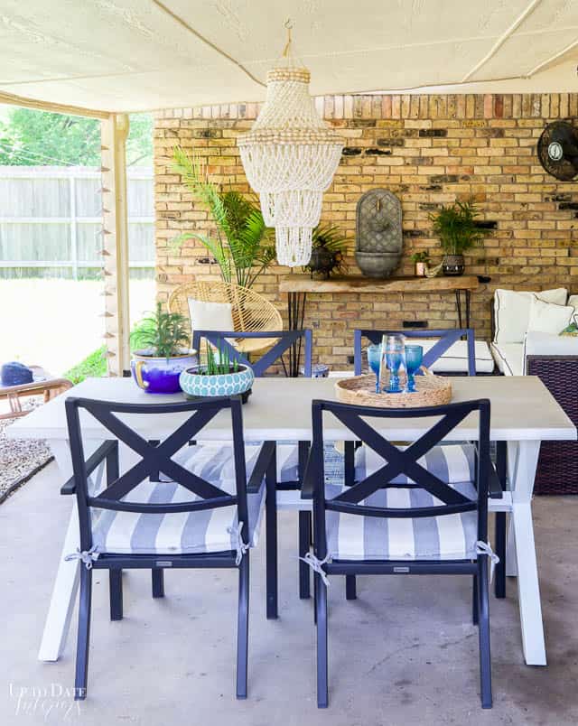 blue and white decor on back porch with a covered living and dining rooms 