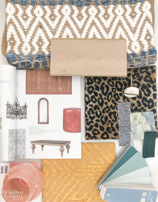 Carpet One Mood Board interior design with floor and paint samples featuring leopard print, pink vase, mustard yellow, and soft blues and greens paint colors. 