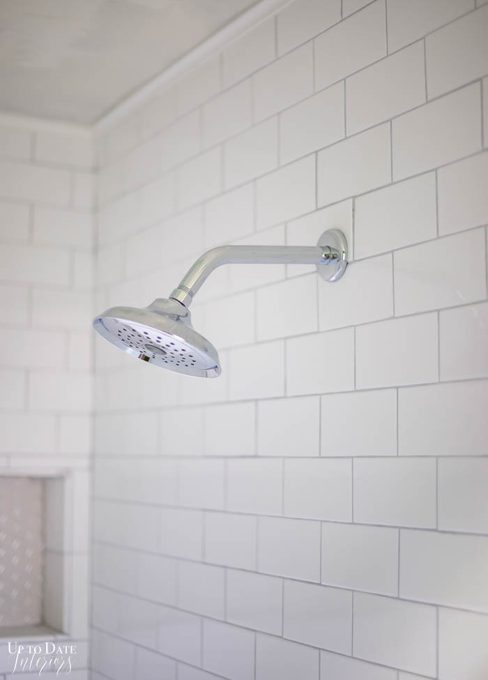 White And Grey shower with chrome shower head. 