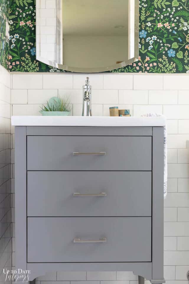 See A Colorful White and Grey Bathroom with Garden Accents